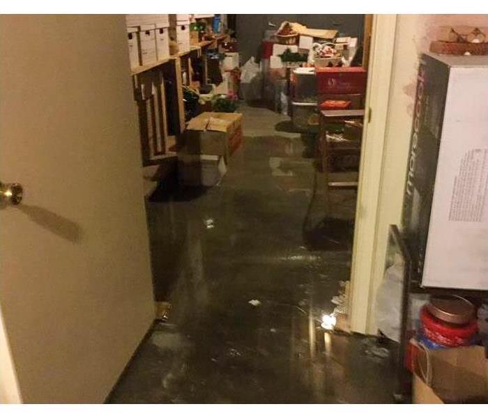 Flood water on the floor of a basement in Joplin, MO